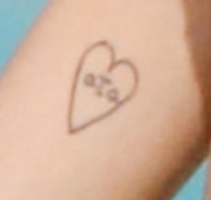 Her tattoo: 'OTO' inside a heart