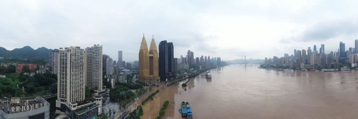 An aerial view of Nanbin Road, Chongqing, hit by severe flooding due to recent heavy downpours in the upper reaches of Yangtze and Jialing rivers on Tuesday. The top level emergency response for floods was triggered. [Photo by Guo Xu/for chinadaily.com.cn]