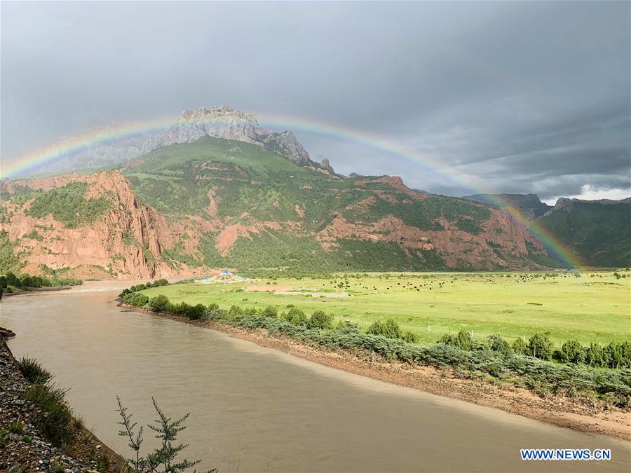 Photo taken on Aug. 22, 2020 shows a rainbow at Angsai Canyon in Zaduo County, Yushu Tibetan Autonomous Prefecture, northwest China
