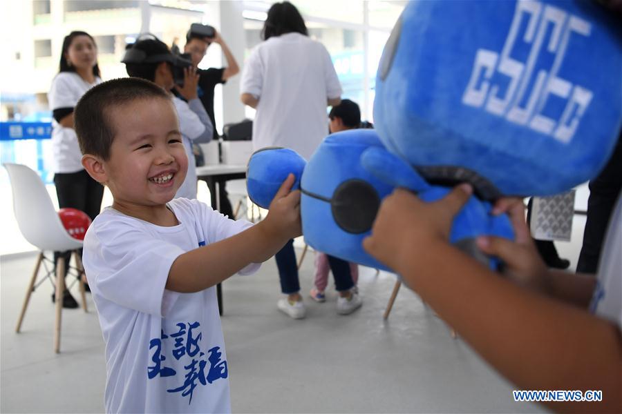 A child plays during a caring activity in Anning District of Lanzhou, northwest China
