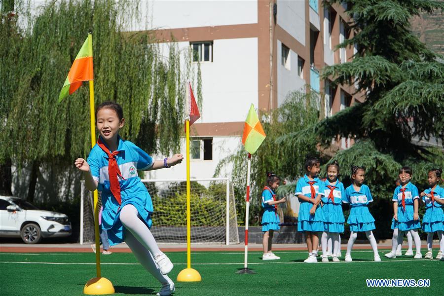 Pupils have PE class at a primary school in Longnan City, northwest China