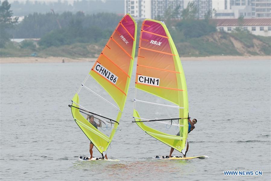 Chen Hao (L) of Zhejiang team competes during the men