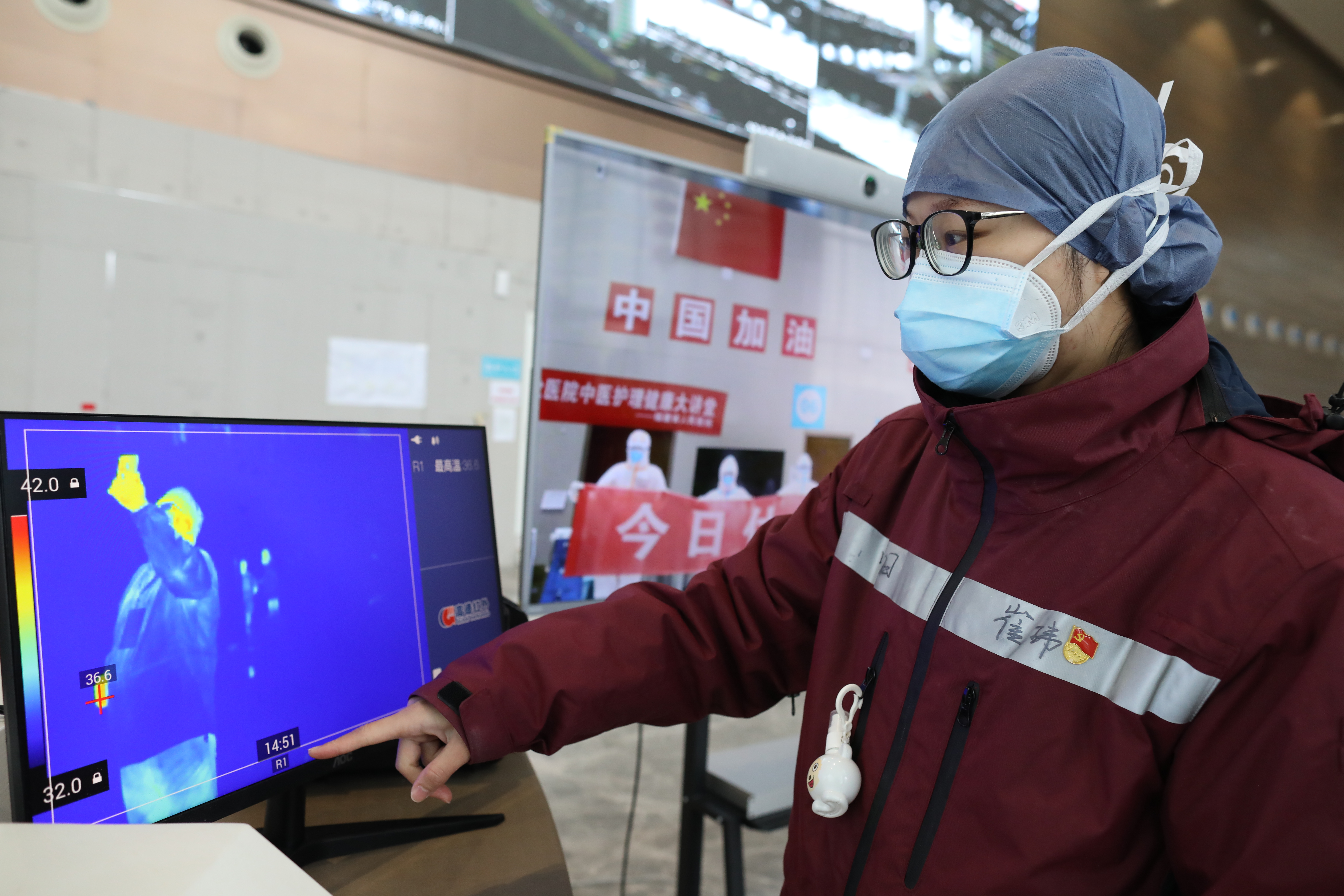 Cui works at a makeshift hospital in Wuhan on March 6. ZHU XINGXIN/CHINA DAILY