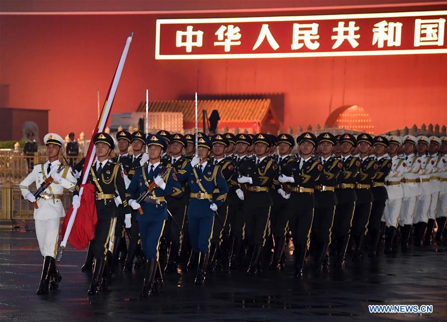 A flag-raising ceremony to celebrate the 71st anniversary of the founding of the People