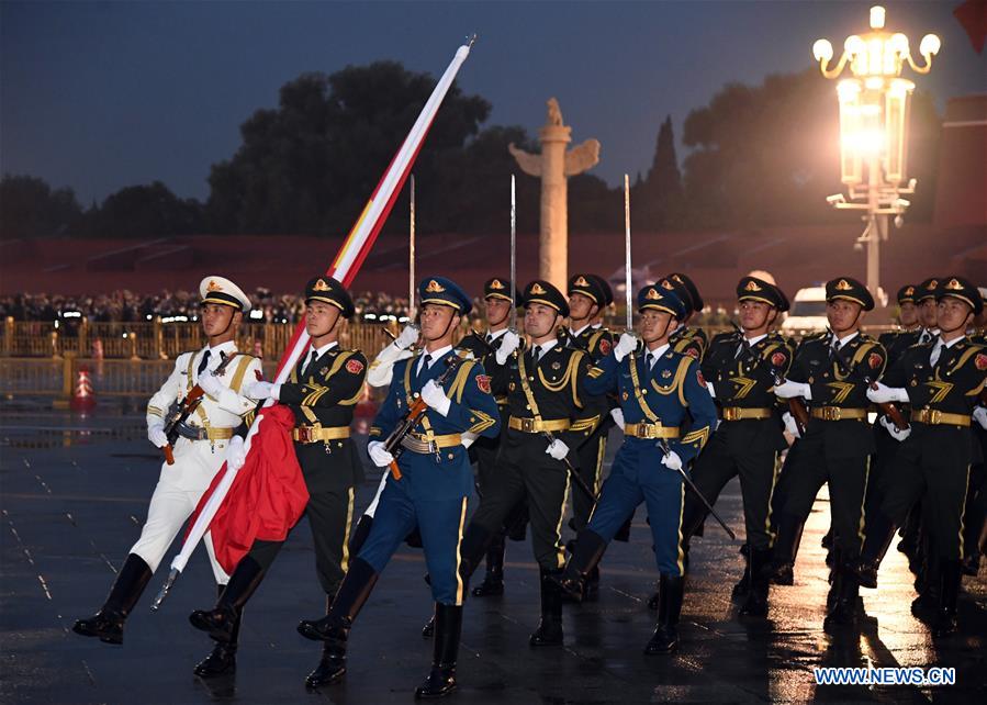 A flag-raising ceremony to celebrate the 71st anniversary of the founding of the People