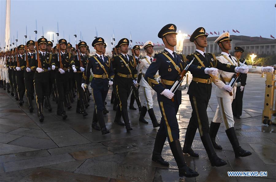 A flag-raising ceremony to celebrate the 71st anniversary of the founding of the People