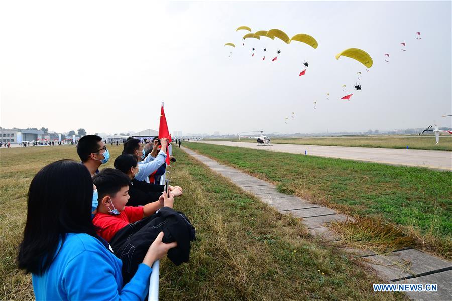 People watch flying performance in Anyang City, central China