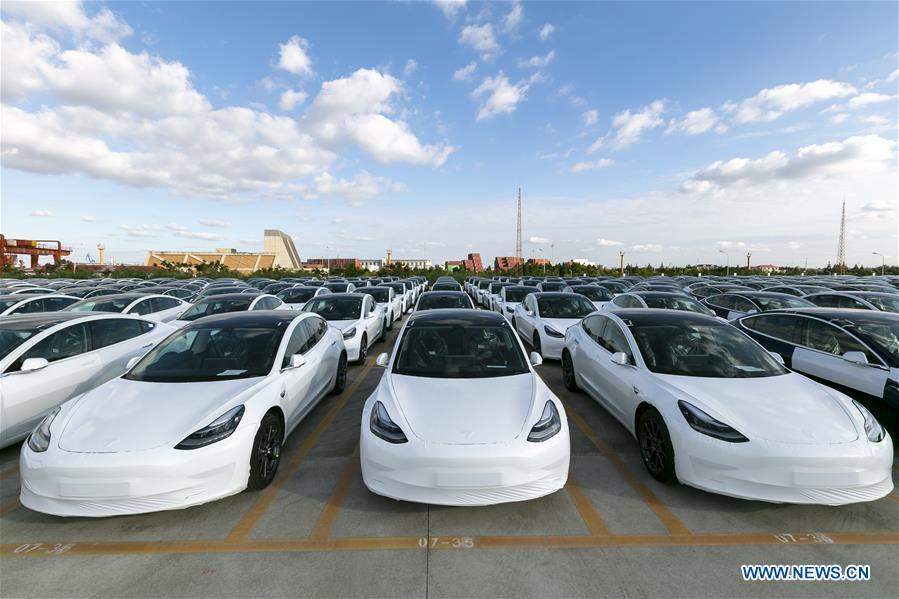 Photo taken on Oct. 19, 2020 shows the Tesla China-made Model 3 vehicles which will be exported to Europe at Waigaoqiao port in Shanghai, east China, Oct. 19, 2020. U.S. carmaker Tesla announced on Monday that it would export the made-in-China Model 3 to Europe, marking another important milestone for its Shanghai Gigafactory. The first batch of exported sedans will leave Shanghai next Tuesday and arrive at the port of Zeebrugge in Belgium at the end of November before being sold in European countries, including Germany, France, Italy, Spain, Portugal, and Switzerland. (Xinhua/Wang Xiang)SHANGHAI, Oct. 19 (Xinhua) -- U.S. carmaker Tesla announced on Monday that it would export the made-in-China Model 3 to Europe, marking another important milestone for its Shanghai Gigafactory.The first batch of exported sedans will leave Shanghai next Tuesday and arrive at the port of Zeebrugge in Belgium at the end of November before being sold in European countries, including Germany, France, Italy, Spain, Portugal, and Switzerland."Relying on China