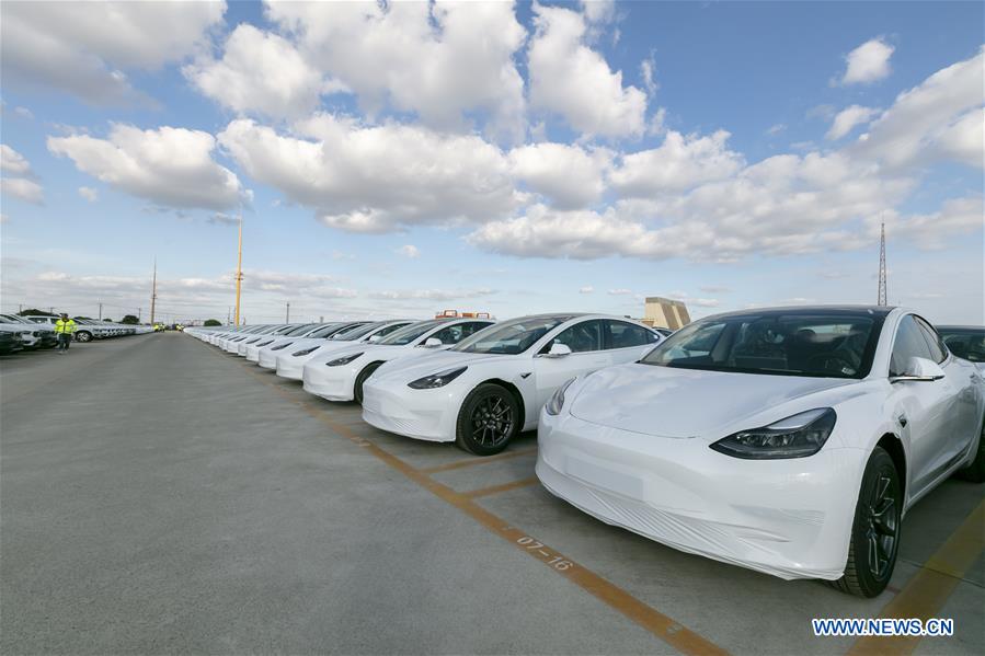 Photo taken on Oct. 19, 2020 shows the Tesla China-made Model 3 vehicles which will be exported to Europe at Waigaoqiao port in Shanghai, east China, Oct. 19, 2020. U.S. carmaker Tesla announced on Monday that it would export the made-in-China Model 3 to Europe, marking another important milestone for its Shanghai Gigafactory. The first batch of exported sedans will leave Shanghai next Tuesday and arrive at the port of Zeebrugge in Belgium at the end of November before being sold in European countries, including Germany, France, Italy, Spain, Portugal, and Switzerland. (Xinhua/Wang Xiang)