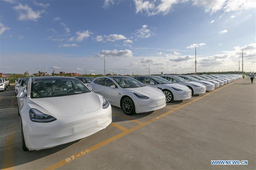 Photo taken on Oct. 19, 2020 shows the Tesla China-made Model 3 vehicles which will be exported to Europe at Waigaoqiao port in Shanghai, east China, Oct. 19, 2020. U.S. carmaker Tesla announced on Monday that it would export the made-in-China Model 3 to Europe, marking another important milestone for its Shanghai Gigafactory. The first batch of exported sedans will leave Shanghai next Tuesday and arrive at the port of Zeebrugge in Belgium at the end of November before being sold in European countries, including Germany, France, Italy, Spain, Portugal, and Switzerland. (Xinhua/Wang Xiang)