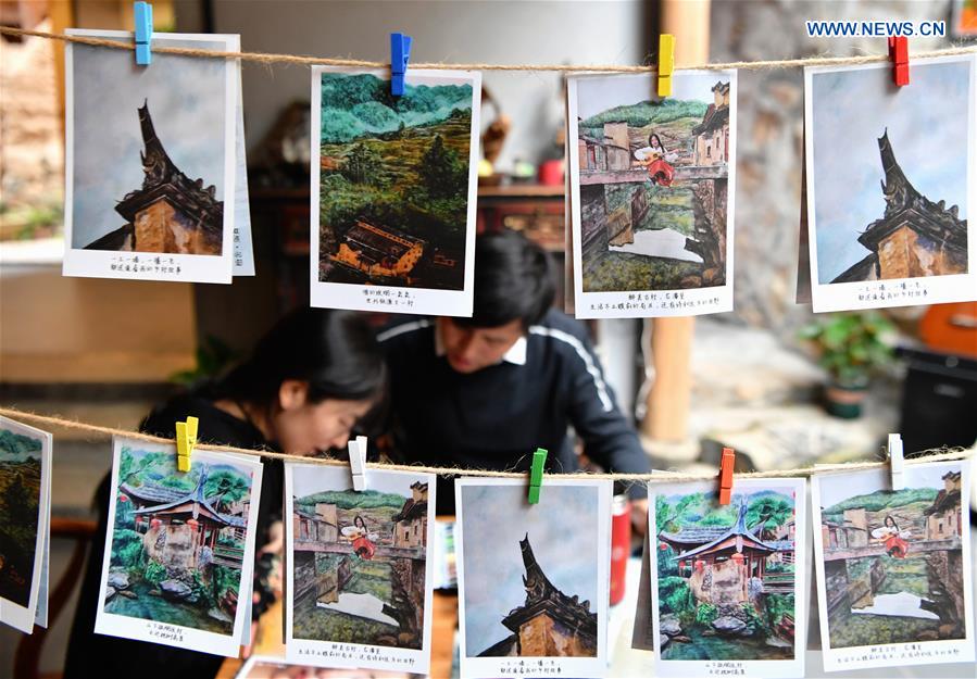 Photo taken on Oct. 21, 2020 shows the postcards made by Hu Wenliang, a professional designer introduced to Longtan Village who started a cultural and creative space here, together with his family, in Longtan Village of Pingnan County in Ningde City, southeast China