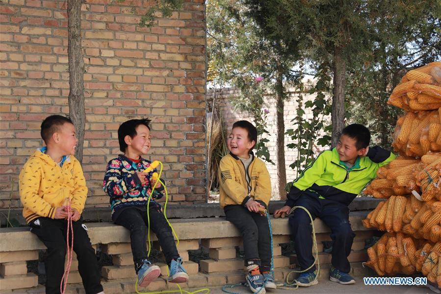 Students play in Changshan School, Huining County, northwest China
