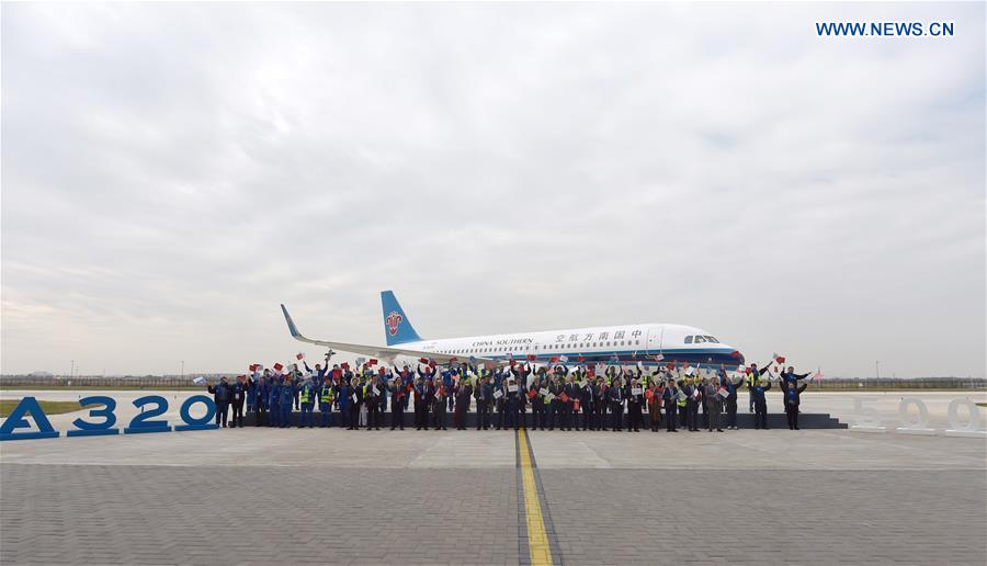 Staff members and guests attend a delivery ceremony of the 500th A320 aircraft assembled at the Airbus Final Assembly Line Asia (FALA) in Tianjin, north China, Oct. 29, 2020. Airbus has delivered the 500th A320 family aircraft from FALA in north China