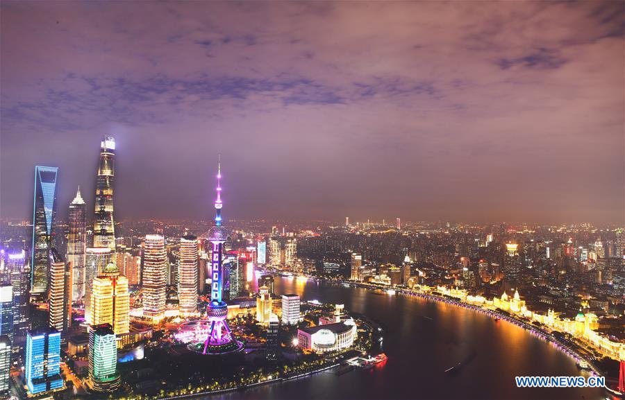 The multiple exposure photo taken on Oct. 26, 2020 shows the night view along the Huangpu River in east China