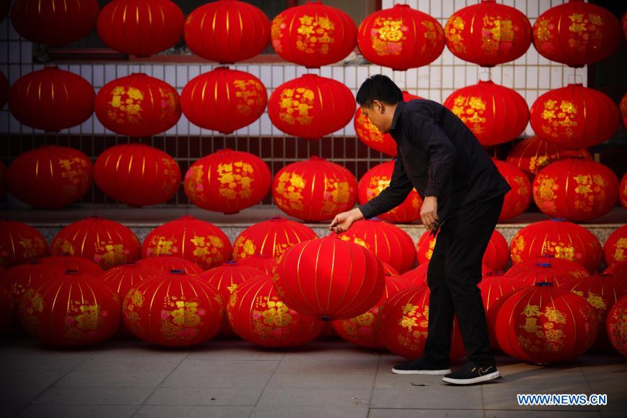 A villager airs red lanterns at Luozhuang Township of Xingtai City, north China