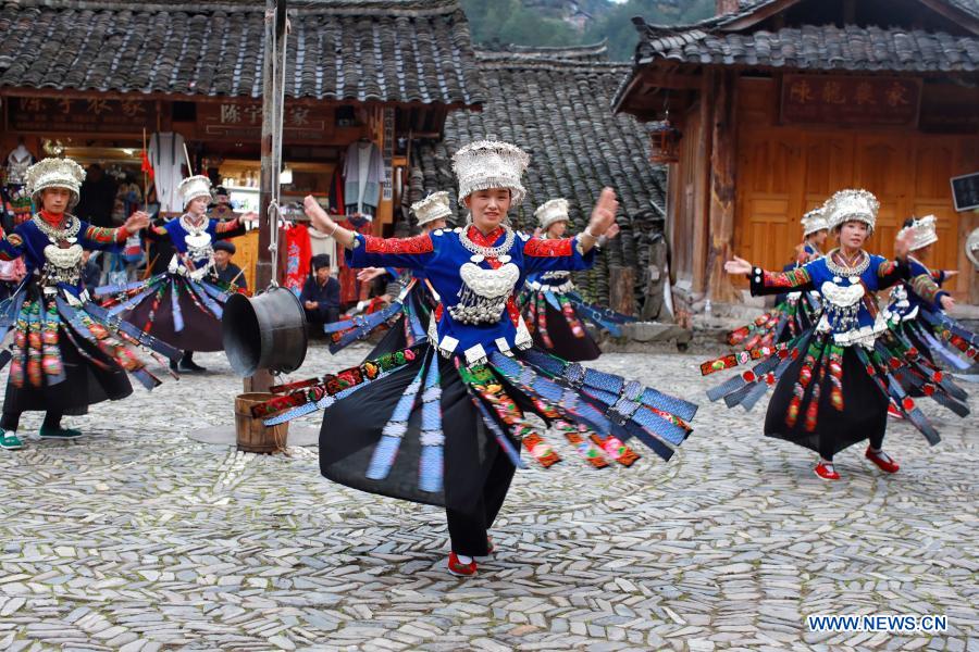 Performers of the Miao ethnic group perform dance for tourists at Langde Village of Miao ethnic group in Leishan County, Qiandongnan Miao and Dong Autonomous Prefecture, southwest China