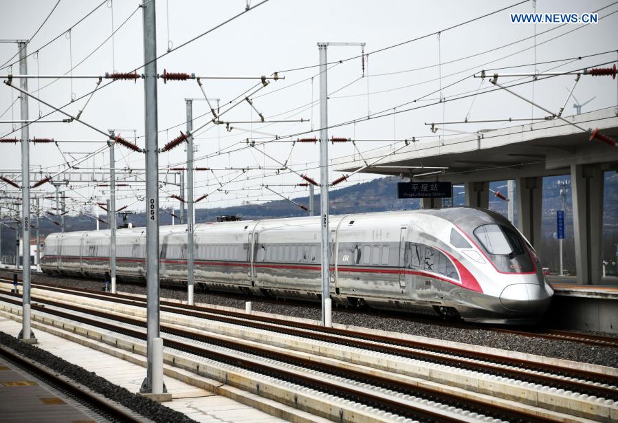 The train No. G9228 departs from the Pingdu Railway Station for Jinan in Pingdu City, east China