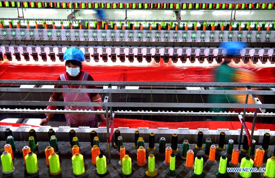 Workers make shoe insoles at a factory in Buxia Village of Nanma Subdistrict in Yiyuan County, Zibo, east China