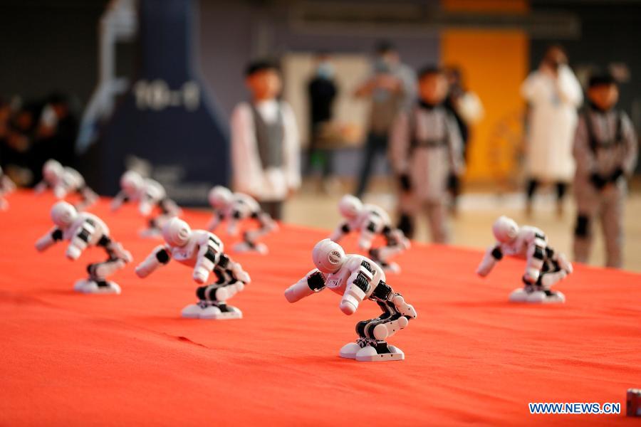 Photo taken on Nov. 29, 2020 shows robots dancing during a robotics competition for middle and primary school students in Jimo District of Qingdao, east China