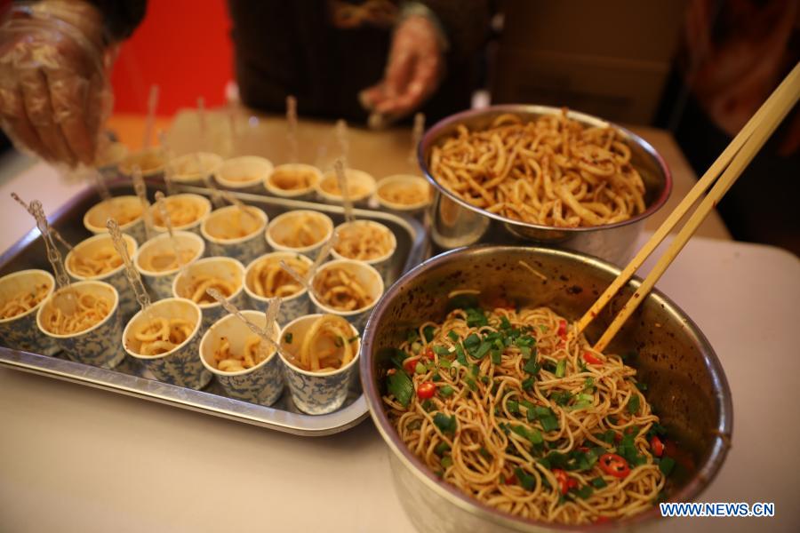 A chef makes Youpo noodles (chili oil noodles) during the 2020 China Pasta Expo held in Lanzhou, northwest China