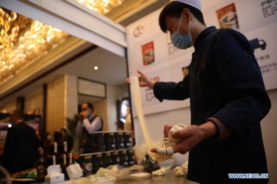 A chef makes beef noodles during the 2020 China Pasta Expo held in Lanzhou, northwest China