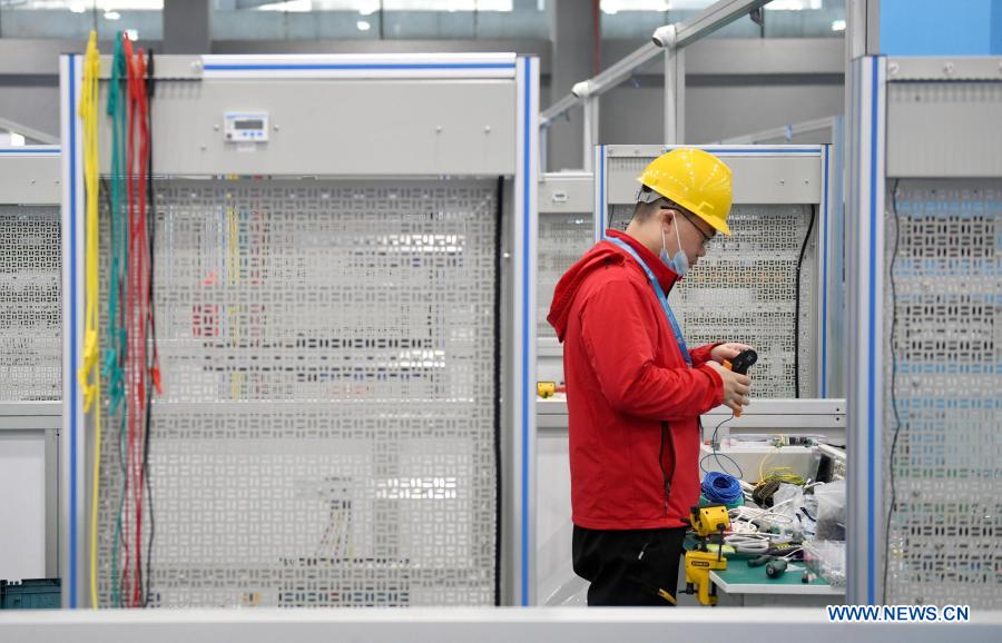 A contestant takes part in an electronic technique contest during the first vocational skills competition in Guangzhou, south China