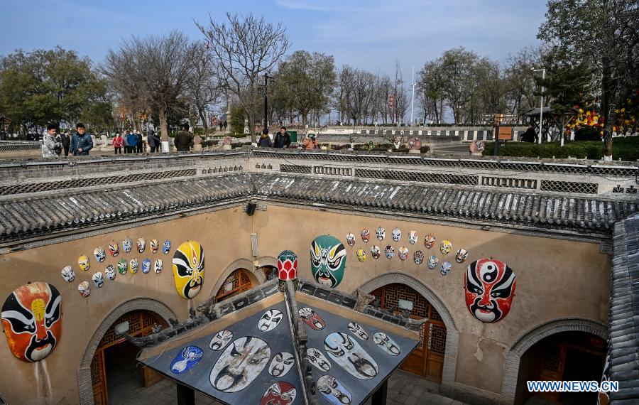 Photo taken on Dec. 10, 2020 shows tourists visiting a traditional Dikengyuan residence in Beiying Village, Zhangbian Township, Shanzhou District, Sanmenxia City of central China