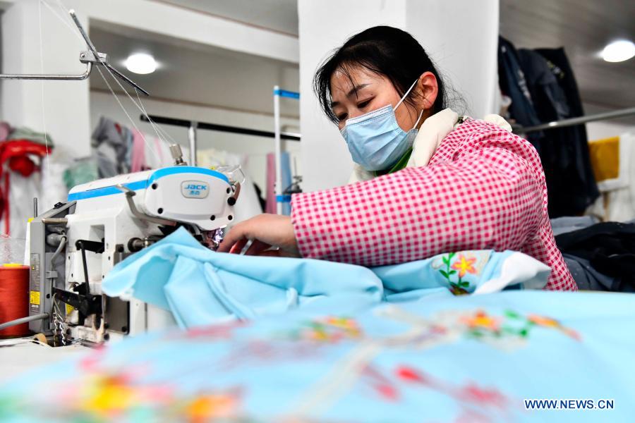 A worker is seen at Hu Chunqing