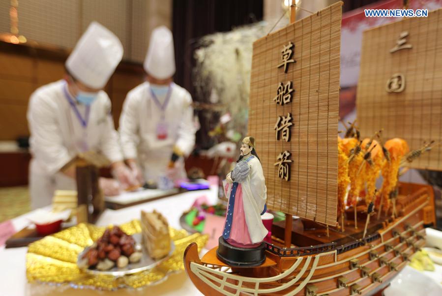 Chefs prepare food during a cooking competition in Yinan county of Linyi City, east China