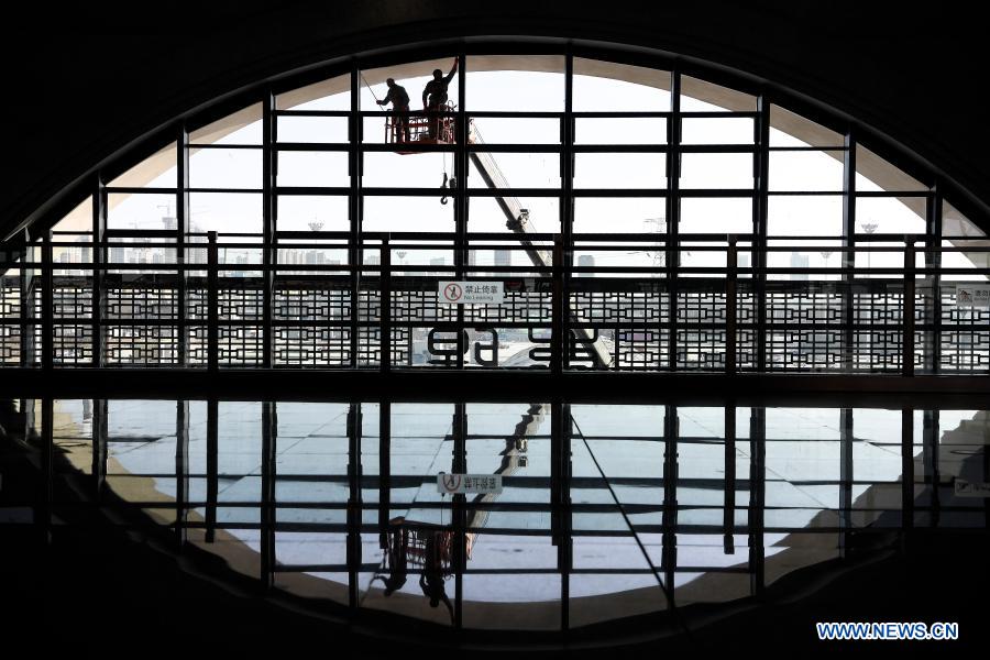 Staff members do cleaning work at the Qingyang Railway Station along the Yinchuan-Xi