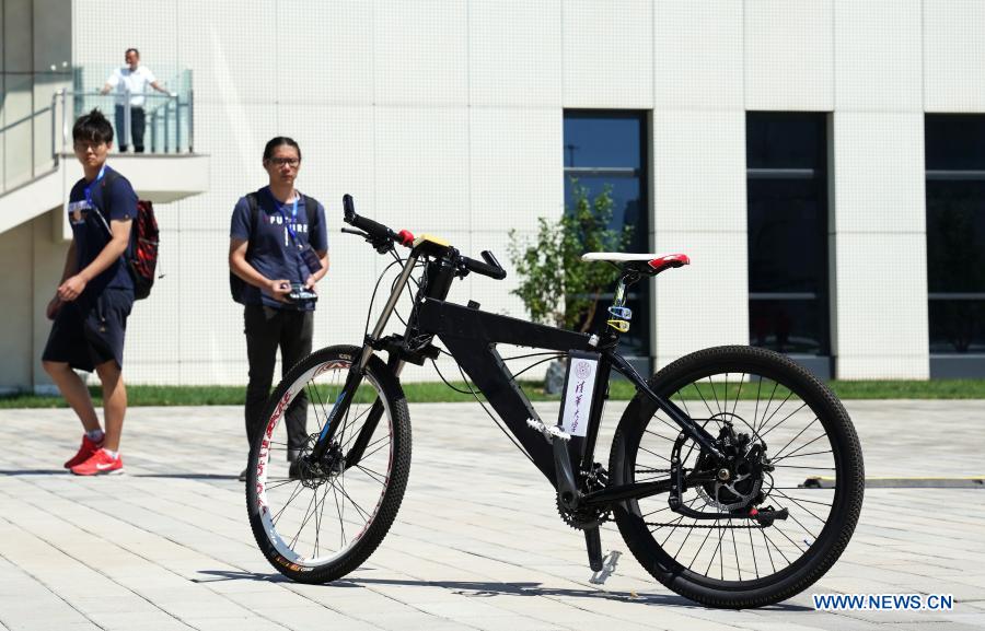 An unmanned bicycle is demonstrated during match break at the 2019 International Competition of Autonomous Walking Intelligent Robots in Beijing, capital of China, Aug. 17, 2019. With the development of new technologies such as the 5G, artificial intelligence and BeiDou Navigation Satellite System (BDS), unmanned technology is injecting impetus into traditional industries as well as making people