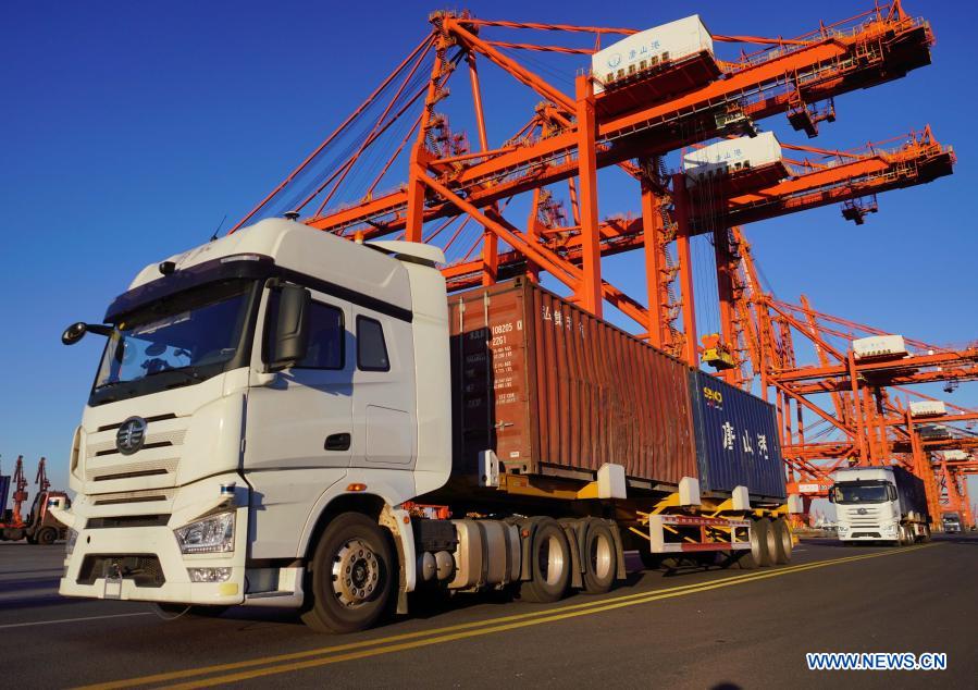 Unmanned container trucks are seen at the container terminal of Jingtang port area of Tangshan Port, north China