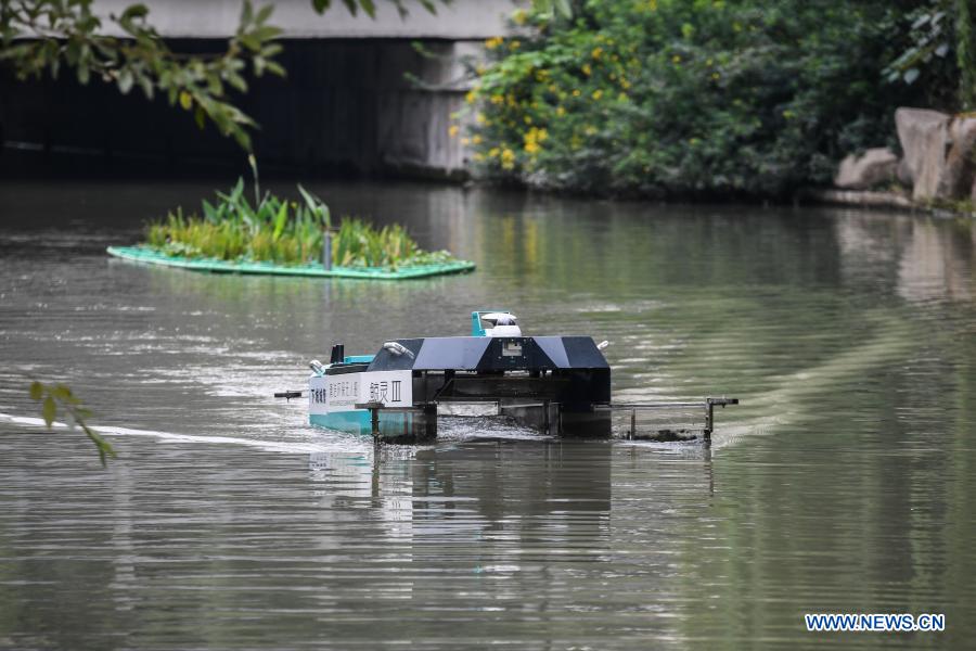 An unmanned patrolling and waste-collecting machine works in a river in Hangzhou, east China