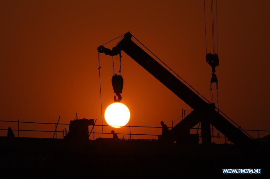 Workers work at the construction site of Beijing-Xiongan intercity railway