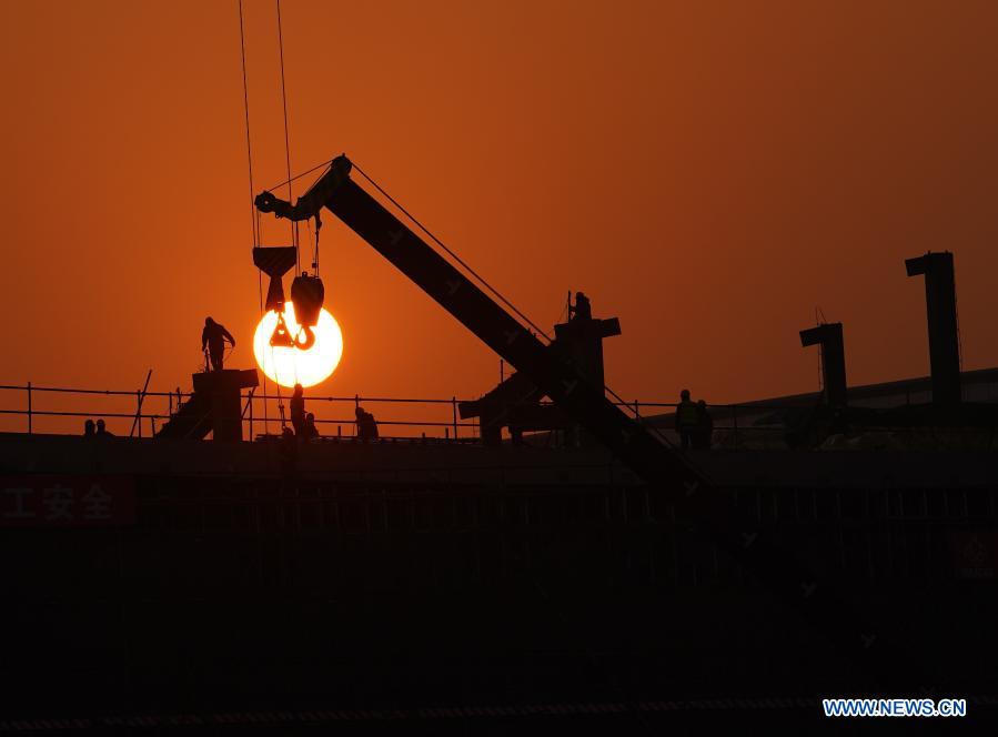 Workers work at the construction site of Beijing-Xiongan intercity railway