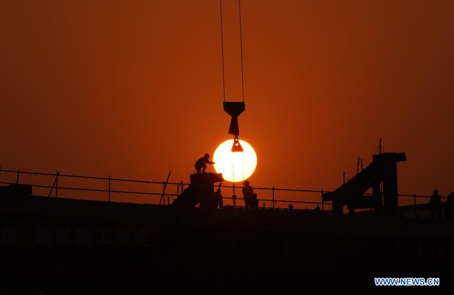 Workers work at the construction site of Beijing-Xiongan intercity railway