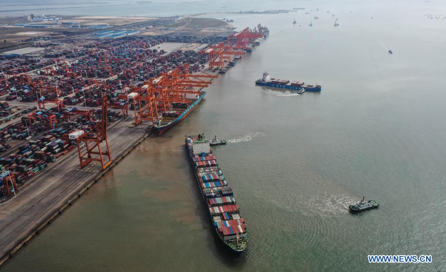 Aerial photo taken on Nov. 19, 2020 shows a cargo ship leaving a berth of the Qinzhou Port in south China
