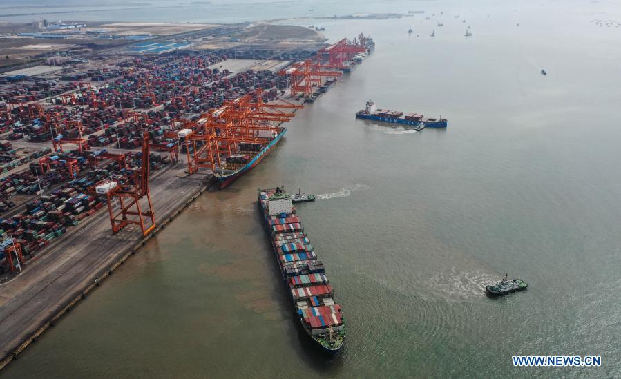 Aerial photo taken on Nov. 19, 2020 shows a cargo ship leaving a berth of the Qinzhou Port in south China