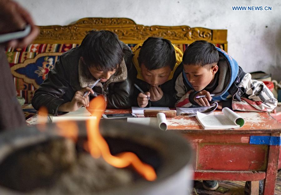 Students take an online class at home in a village in Damxung County, southwest China