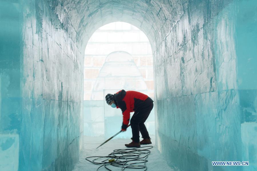 Sun Hongyan works in the venue of Harbin Ice and Snow World in northeast China