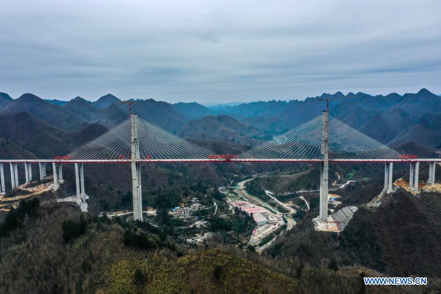 Aerial photo shows the construction site of the 1,720-meter-long Yunwu Bridge of the Duyun-Anshun expressway in Guiding County, southwest China