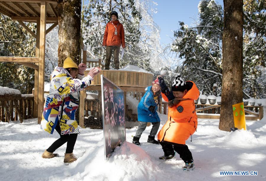 Students from Huchangbao Primary School have snow fight at a camp in Longcanggou National Forest Park in Yingjing County, southwest China