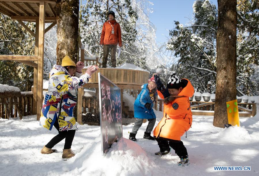 Students from Huchangbao Primary School have snow fight at a camp in Longcanggou National Forest Park in Yingjing County, southwest China