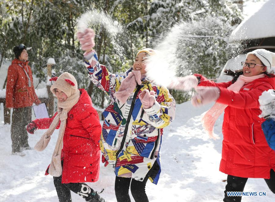 Students from Huchangbao Primary School have snow fight at a camp in Longcanggou National Forest Park in Yingjing County, southwest China