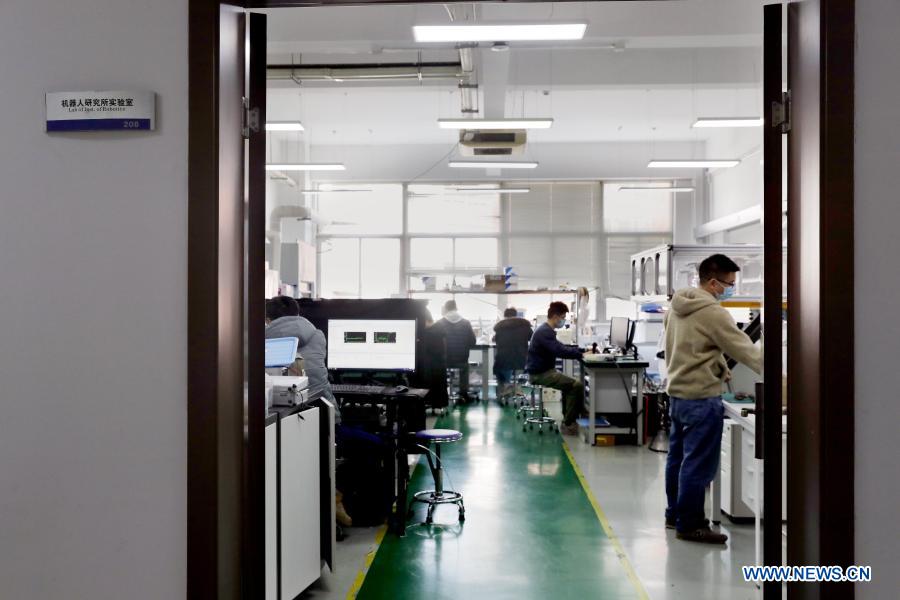 Teachers and students do experiments at a laboratory in the Shanghai Jiao Tong University, east China