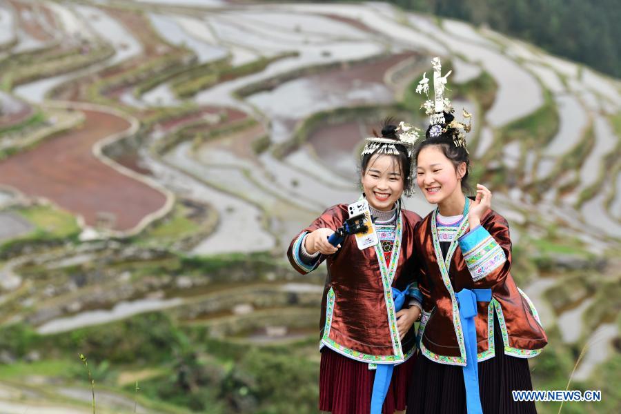 Wu Xianyan and college student Liang Qiongying promote local tourism via live streaming at Jiache Village, Jiabang Township in Congjiang County of southwest China