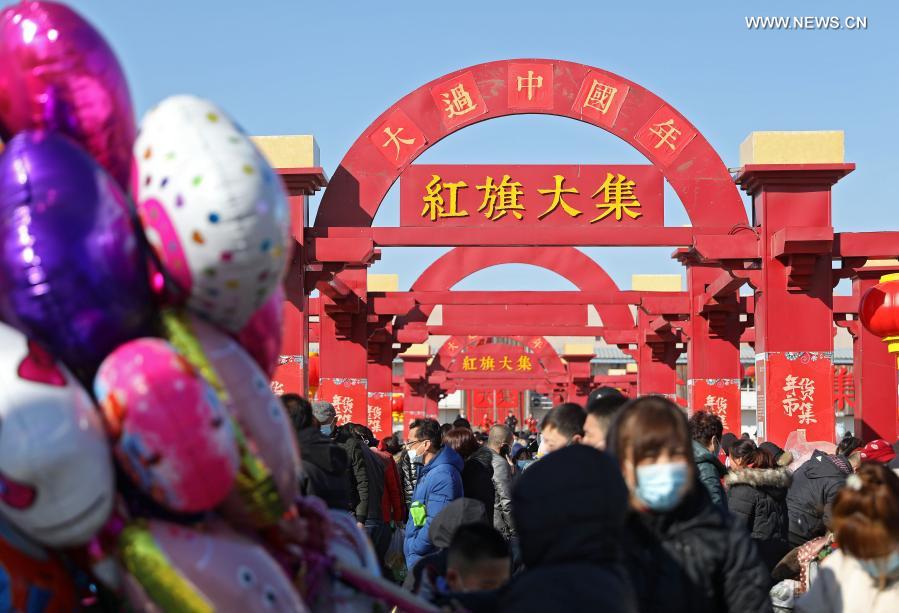 Citizens visit a traditional Spring Festival fair held in Bayuquan District of Yingkou, northeast China