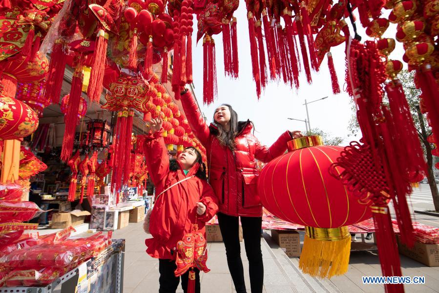 NANCHONG, Feb. 10, 2021 (Xinhua) -- Customers purchase decorations for the upcoming Chinese Lunar New Year in Langzhong city, southwest China