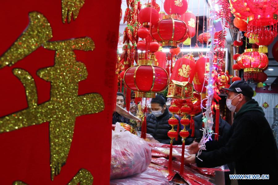 Customers purchase decorations for the upcoming Chinese Lunar New Year in Nanjing City, east China