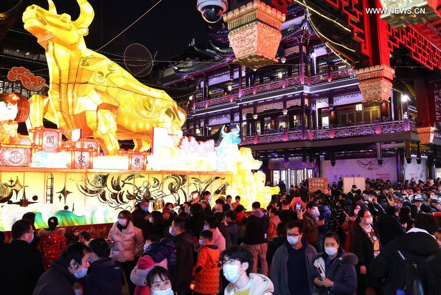 Tourists visit the Yuyuan Garden scenic area in east China